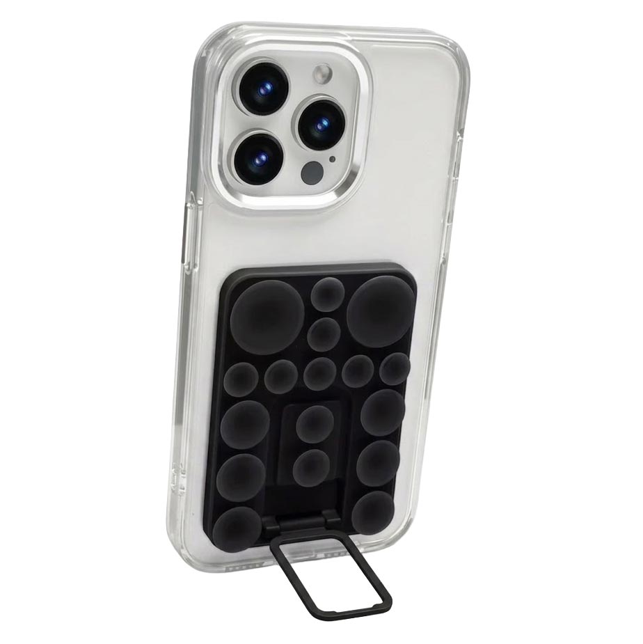TecHub silicone suction mobile phone folding stand holder attached to a surface, showing its portable design and adjustable support.