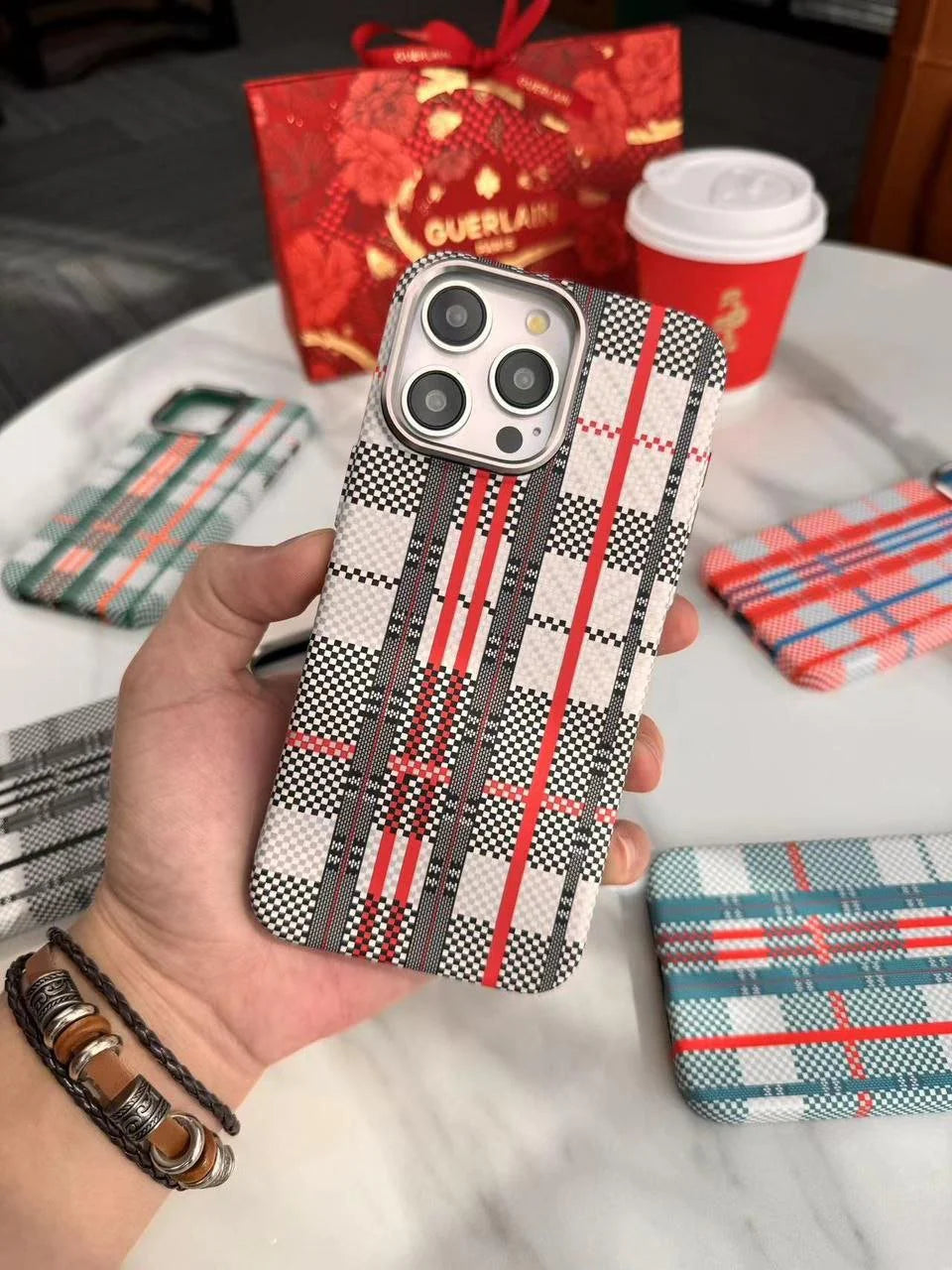 Red and blue carbon fiber MagSafe case for iPhone 15 Pro Max by FreeAir, featuring sleek, lightweight, and durable design.