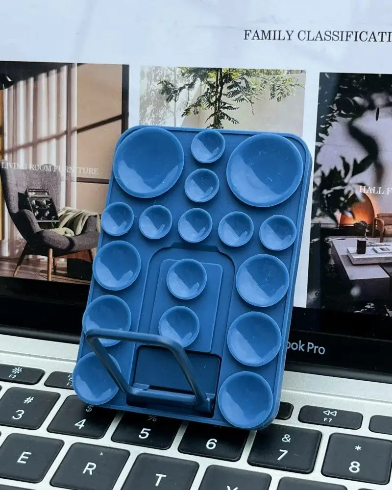 Silicone suction mobile phone folding stand holder by TecHub with adjustable angle and secure grip for hands-free use.