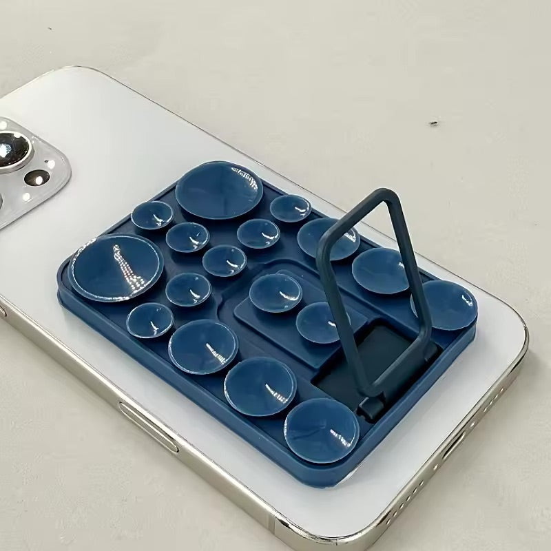 TecHub silicone suction mobile phone folding stand holder showing a compact, adjustable holder with a suction base for hands-free use.