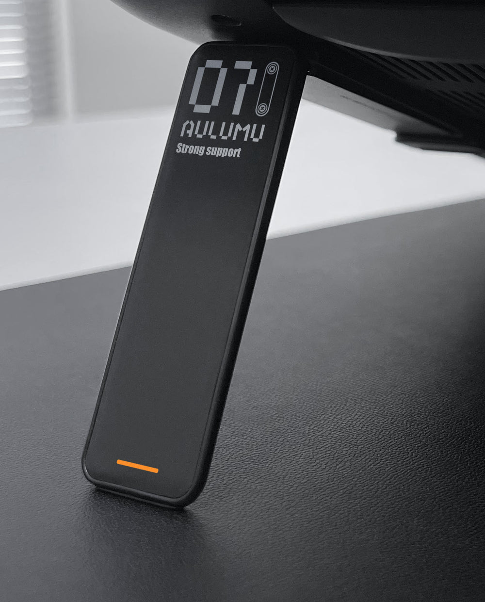 Black TecHub AULUMU G07 POP-UP laptop stand showing the compact, foldable design and adjustable support for ergonomic use.