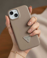 Grey Guess leather back cover case for iPhone 15, featuring a sleek design and precise cutouts for easy access to ports.