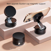 Black TecHub GOJI G10 magnetic phone holder with 360-degree rotation and strong magnetic grip, mounted on a car dashboard.