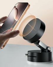 TecHub GOJI G10 magnetic phone holder in black with 360-degree rotation and strong magnetic grip, mounted on a vehicle dashboard