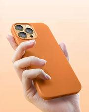 Orange OKOZ premium leather iPhone 15 Pro case with shockproof design, compatible with MagSafe, featuring a sleek, textured surface.