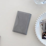 Triple fold leather MagSafe wallet card holder case by TecHub, showcasing its sleek design and multiple card compartments.