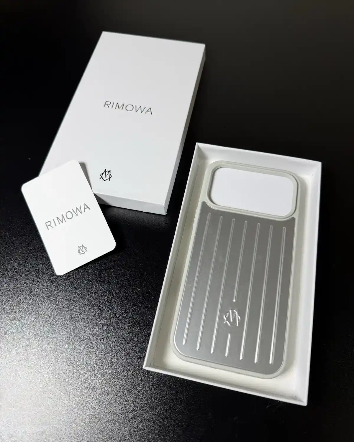 TecHub RIMOWA iPhone 17 Pro Max aluminium silicone case showing the sleek black finish and precise cutouts for buttons and camera.